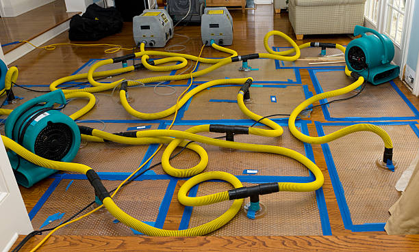 Professional Flood Damage Restoration technician working in New Hampshire, OH